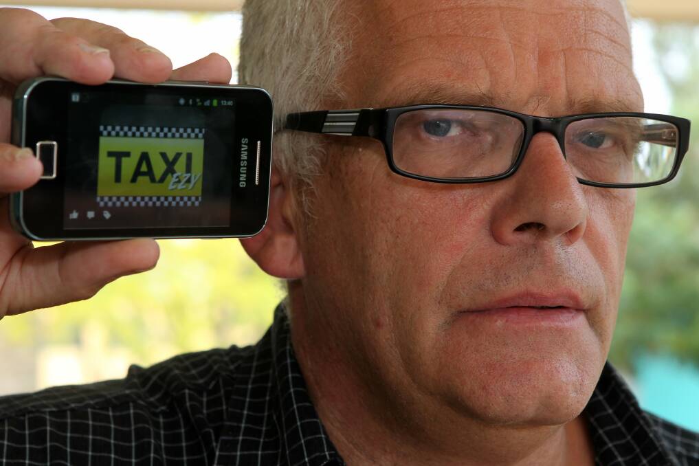 Henk Haasjes is the first Wollongong taxi driver to use the Taxi Ezy app for smartphone cab bookings.Picture: GREG TOTMAN