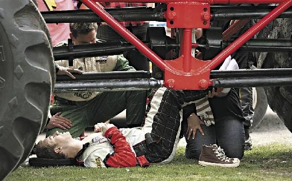 Grant Denyer lies on the ground after yesterday's crash at Dapto Showground involving a 7.5-tonne monster truck.  Picture: JOSHUA DOWLING