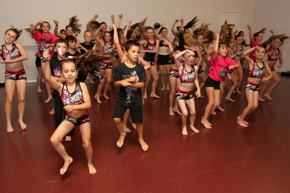 Students at NRG Studios go Gangnam Style as a warm-up to the hip-hop class. Picture: GREG TOTMAN