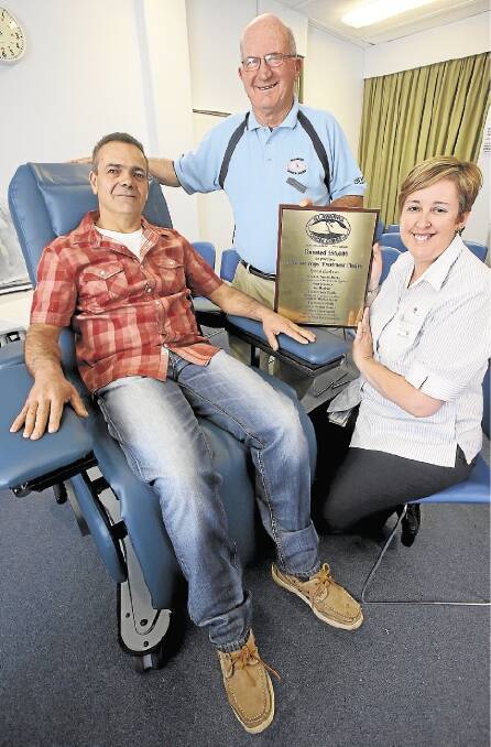 Seated: Manuel Aranega, left, Keith Wilson from the Cancer Carers group and Lisa Cook from Wollongong Hospital with one of 10 new chemotherapy chairs.Picture: ROBERT PEET