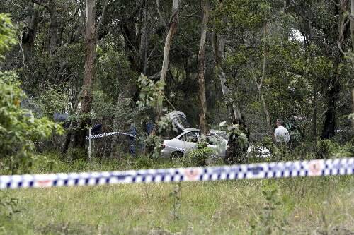 Police scour bushland at the Oak Flats reserve where the body of Rebecca Apps was found on Thursday. A man has been charged with her murder.