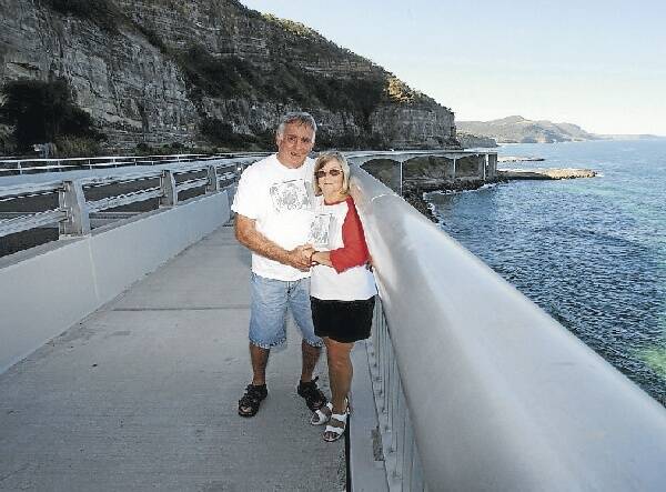 John and Faye Ireland were the first couple to put a padlock on Sea Cliff Bridge, in 2006, and have started a popular trend. Picture: ROBERT PEET