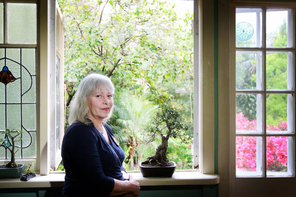 Gabrielle Gibson with her bonsai trees at home. Picture: SYLVIA LIBER