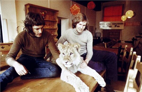 Anthony Bourke with John Rendall, and Christian the lion in their London shop circa 1969.