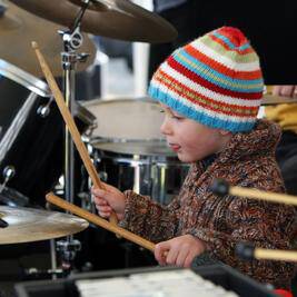 Lonnie Rooney, 2, plays as part of the Concord Community Band.