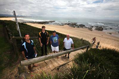 Ian Lee (left), Jeremy Kuyper, Chris Clayton  and John Wren   want  a permanent watch on the unpatrolled Puckeys Beach following a drowning last year. Picture: KIRK GILMOUR