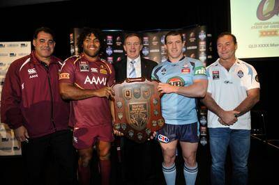 Victorian Minister for Sport, Hugh Delahunty, holds the "State of the Origin" shield with Sam Thaiday and "Paul Callen". Photo: JUSTIN MCMANUS