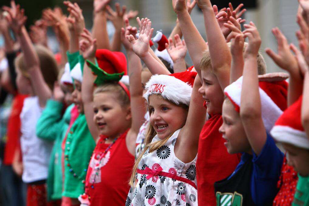 Woonona Primary students sing Rudolph the Red-Nosed Reindeer. Picture: KEN ROBERTSON