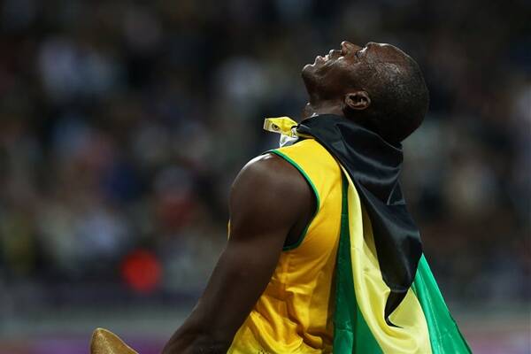 Jamaican sprinter Usain Bolt celebrates after winning the 100 metre final. Picture: STEVE CHRISTO