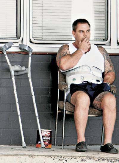 Spinal patient Daryl Stansbury has a smoke at Wollongong Hospital's Crown St entrance for the last time. Picture: KEN ROBERTSON