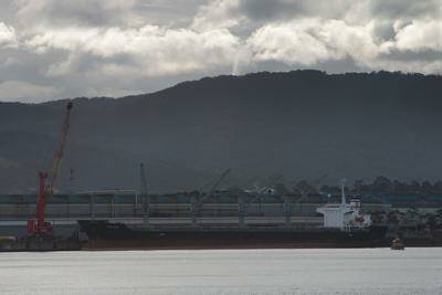 Down tools: A vessel lies idle at BlueScope berth. Picture: KEN ROBERTSON
