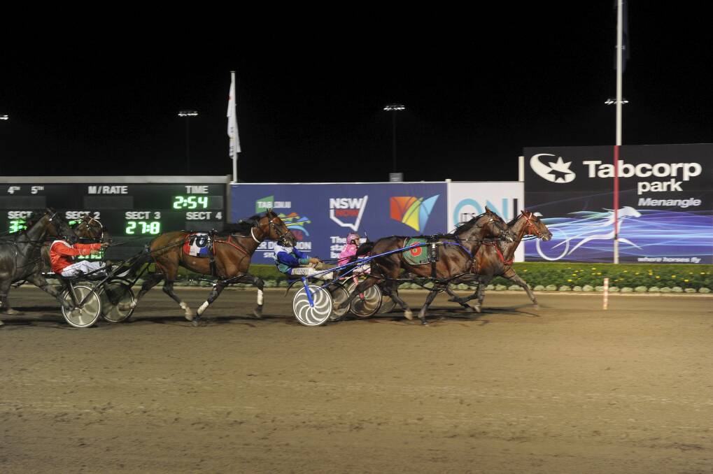 Lauren Panella and Mach Beauty (inside) upset Luke McCarthy's long odds-on favourite For A Reason in the second NSW Inter Dominion heat at Menangle on Saturday night.