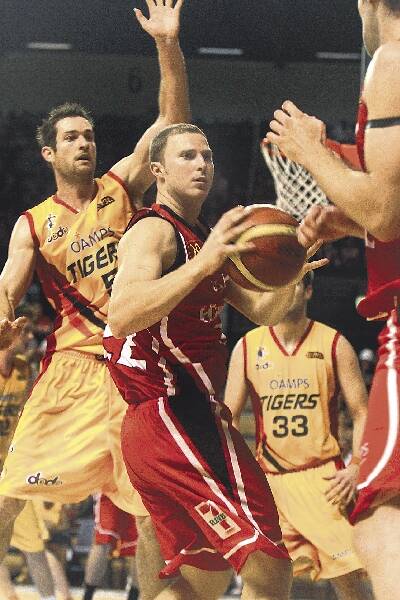 Hawk Tim Coenraad looks to pass the ball during his team's 82-79 win over the Adelaide 36ers, which saw the Hawks climb to second on the ladder. Picture: SYLVIA LIBER