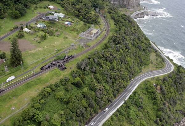 An aerial view of the coal train derailed on the South Coast rail line at Clifton. Coal wagons spilled coal over the line, which was closed by the incident.  Photo: ANDY ZAKELI
