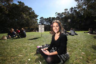 UOW communications student Katie Challita, with her mobile phone. Picture: ADAM McLEAN