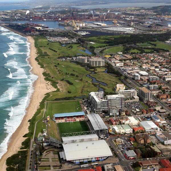 Aerial images of Wollongong’s WIN Stadium and new western grandstand and, in the background,  BlueScope Steel’s Port Kembla plant.  Picture: ANDY ZAKELI