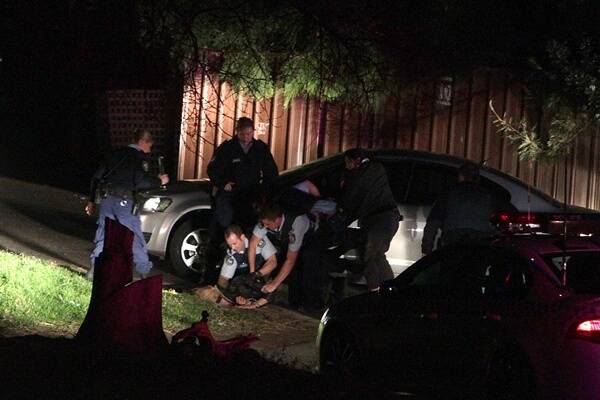 Police officers at the scene of the arrests at Kemblawarra. Picture: SYLVIA LIBER