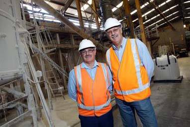 Hydromet project development manager Barry Wyborn and site manager Peter Segura with material being recycled by the Unanderra plant for export. Picture: KEN ROBERTSON