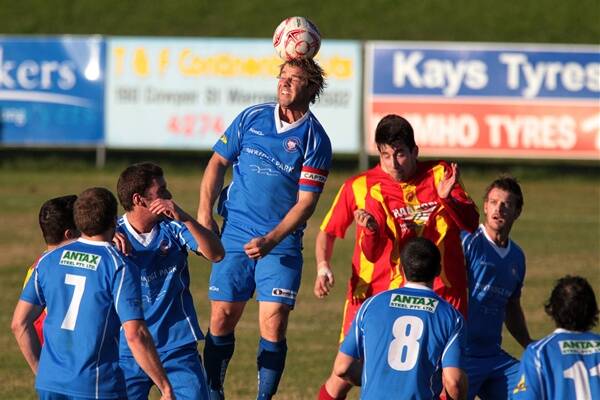 Fernhill’s Monte Pfrengle rises for a header at Macedonia Park, as the Foxes leave Wollongong United stunned. Picture: GREG TOTMAN 