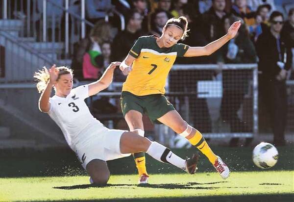 New Zealand's Anna Green (left) tackles Matilda Caitlin Foord in yesterday's friendly. Picture: ORLANDO CHIODO