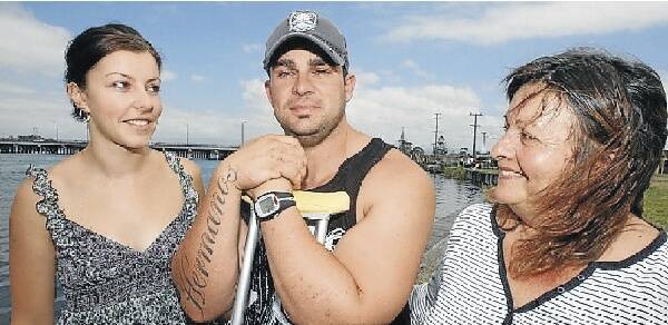 Steven Fogarty with wife Amanda and mother Julia at Lake Illawarra yesterday. Picture: ROBERT PEET
