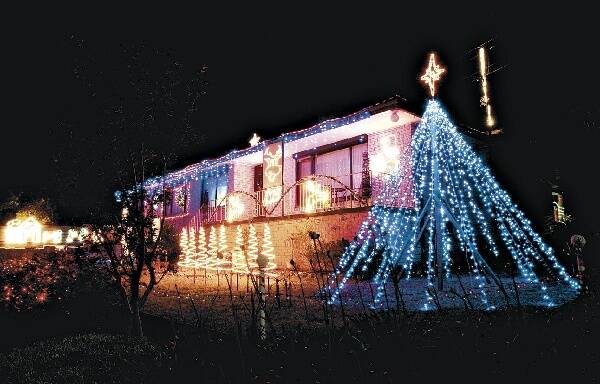 Craig Galvin's house in Vista Rd, Farmborough Heights. The lights are linked to his computer and synchronised to music, allowing visitors to tune into a radio station and experience a light and sound show. Picture: ANDY ZAKELI