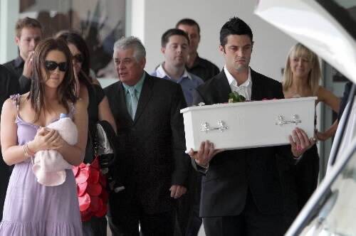 Jay Marmont carries the coffin bearing his daughter Lila, who was farewelled by family and friends yesterday. Picture: ANDY ZAKELI