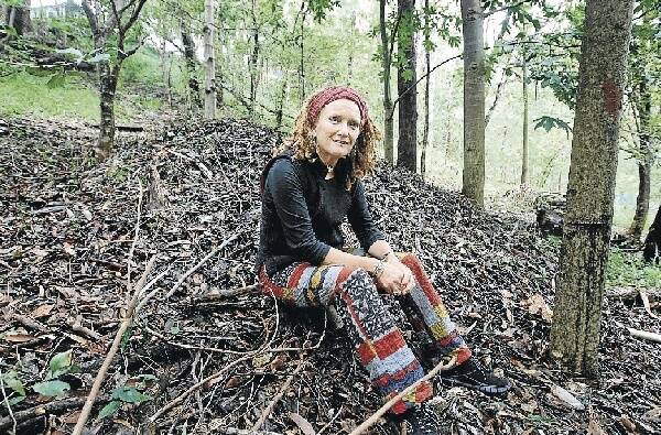 Wollongong City Council's Sue McGregor beside Bob the bush turkey's favourite love mound.Picture: SYLVIA LIBER