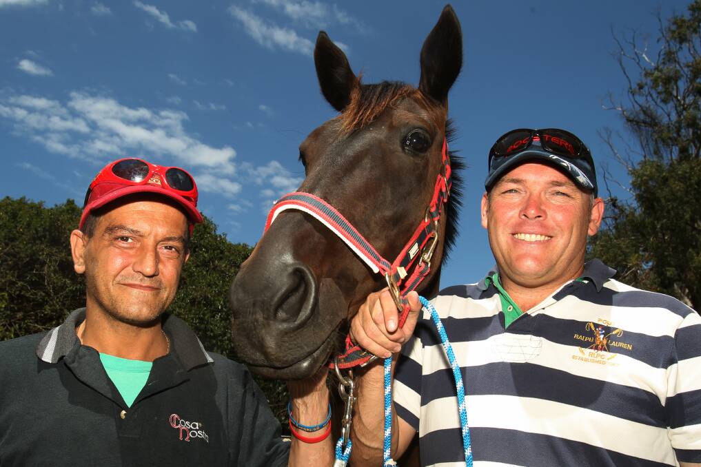 Pacer Billy Phelps with owner Pete Piras, left, and trainer Mark Tracey, right. Picture: GREG TOTMAN