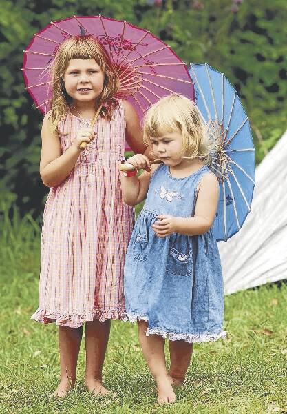 Lara Kelly, 5, and sister Grace, 2, added an oriental flavour to the Illawarra Folk Festival, which is being staged at Bulli this weekend.