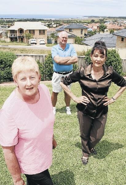 Shell Cove residents Jan Chauncy (left), Philip Chauncy and Cherie McBeth are angry over the suburb's delayed marina and want answers from Shellharbour City Council. Picture: ROBERT PEET