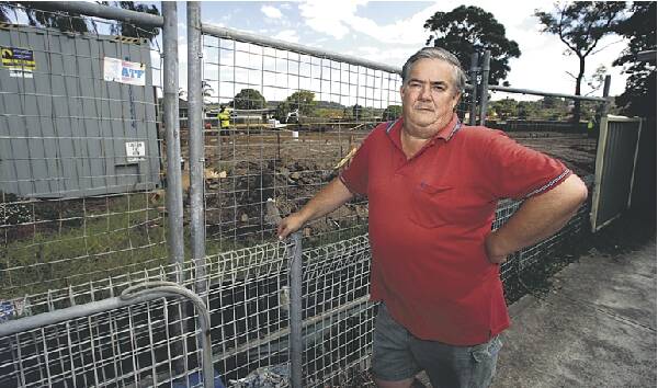 Barrack Heights resident Kerry Southwell next door to the Housing NSW project. Picture: GREG TOTMAN