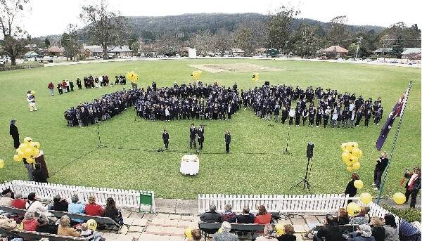 Bowral students sing Happy Birthday to Sir Donald Bradman on the oval where his cricketing career began. Pictures: SYLVIA LIBER
