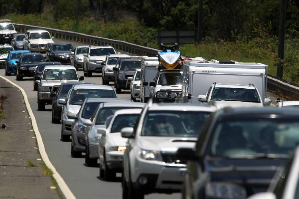Car park: Motorists on the Princes Highway at Albion Park Rail hit gridlock as they head south. Picture: GREG TOTMAN