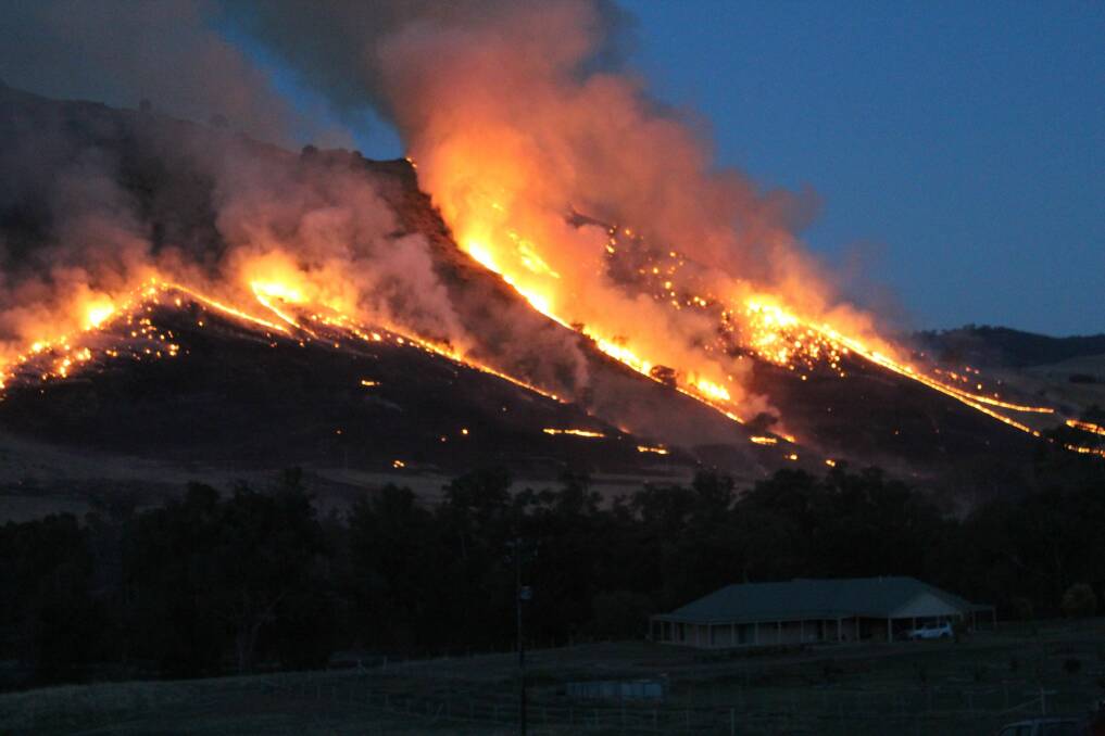 A backburn operation engulfs scrubland near Jugiong. The fire was lit to prevent the spread of the Cobbler Road fire.