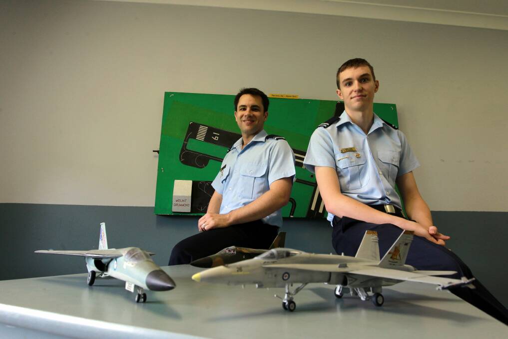 Taking off: Flying Officer Paul Barrett and Cadet Under Officer Nicholas Lyon are on an Air Force Cadets recruitment drive. Picture: SYLVIA LIBER