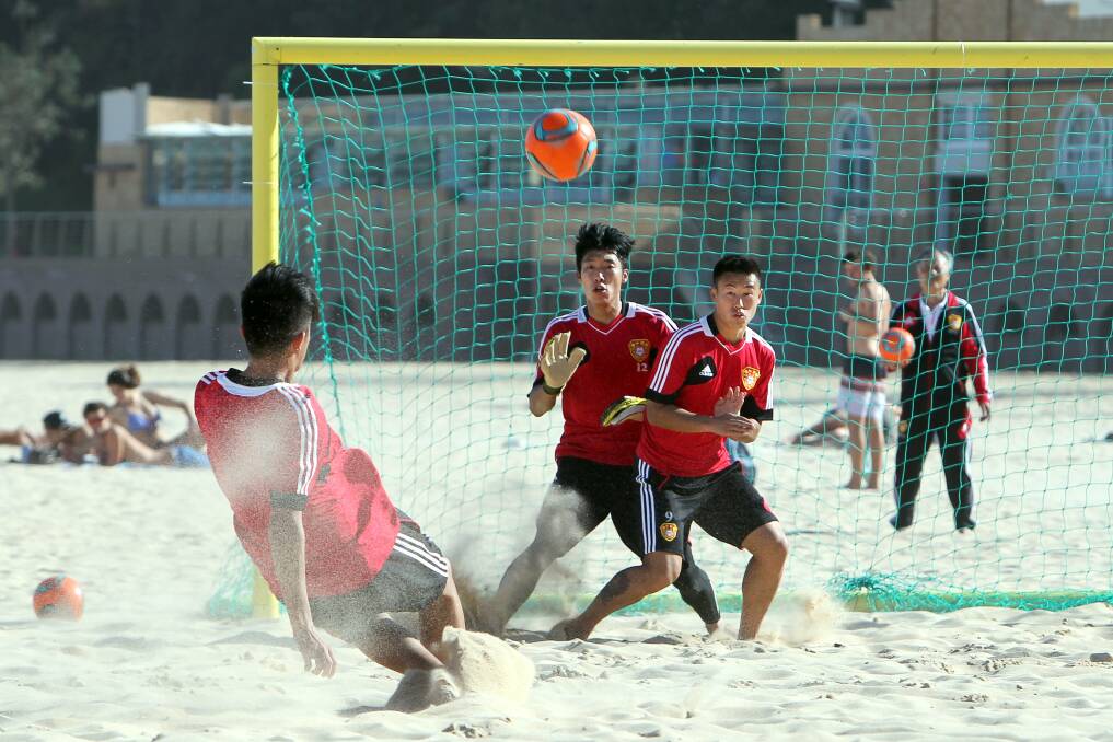 The Chinese beach soccer team trains at North Beach for the Australian Cup tournament. Picture: SYLVIA LIBER