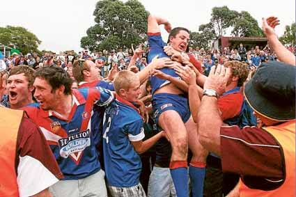 Greg Sharpe crowd surfs with the Lions supporters after their thrilling grand final win.