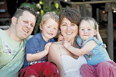 Young Oak Flats mum Sarah Turk, who lost her battle with motor neurone disease yesterday, with her husband Jason and children Logan, 4, and Hannah, 2. The illness has also claimed her mother, grandmother and two cousins.