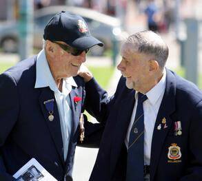 Cyril Bevan of Wollongong greets Bill Atkinson of North Wollongong before the service at Wollongong cenotaph. Picture: ANDY ZAKELI