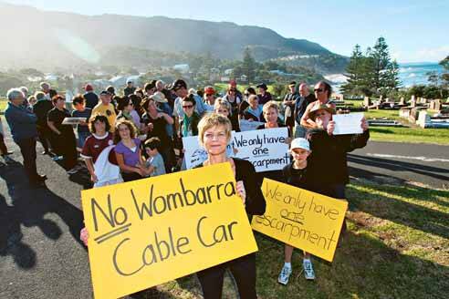 Vida Bliokas leads protesters at Scarborough Cemetery on Saturday against businessman John Watson's "completely inappropriate" plan for an Austrian-designed cable car at Wombarra. Picture: DAVE TEASE