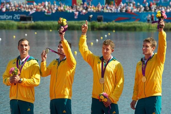 Warilla's David Smith (second from left), with his K4 teammates, celebrate winning gold in London. Picture: REUTERS
