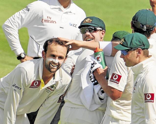 ADELAIDE, AUSTRALIA - NOVEMBER 25:  Nathan Lyon of Australia is congratulated by his team mates after dismissing Jacques Rudolph of South Africa during day four of the Second Test Match between Australia and South Africa at Adelaide Oval on November 25, 2012 in Adelaide, Australia.  (Photo by Scott Barbour/Getty Images)