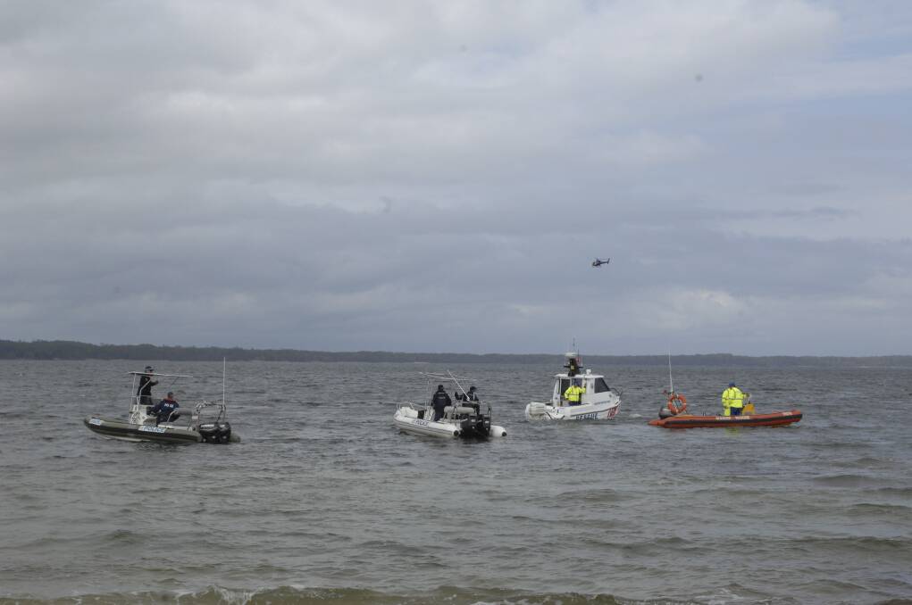 Emergency teams search for the bodies. Picture: ADAM WRIGHT