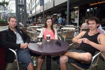 University of Wollongong students Cal Thomson, Brittany Reeves and Ryan Brown in Crown St Mall. Picture: ROBERT PEET