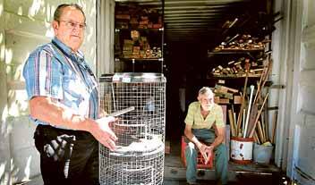 Dennis Hamilton and Lothar Piarnke from the Corrimal Men's Shed with the myna bird traps they hope will get rid of the pest. Picture: SYLVIA LIBER