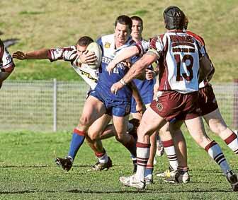 Gerringong's Greg Sharpe charges through the Eagles defence yesterday in his side's 22-16 victory.