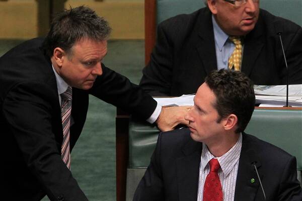  In Federal Parliament, Throsby's Stephen Jones is spoken to by Labor's chief whip Joel Fitzgibbon at Parliament House Canberra.Picture: ANDREW MEARES