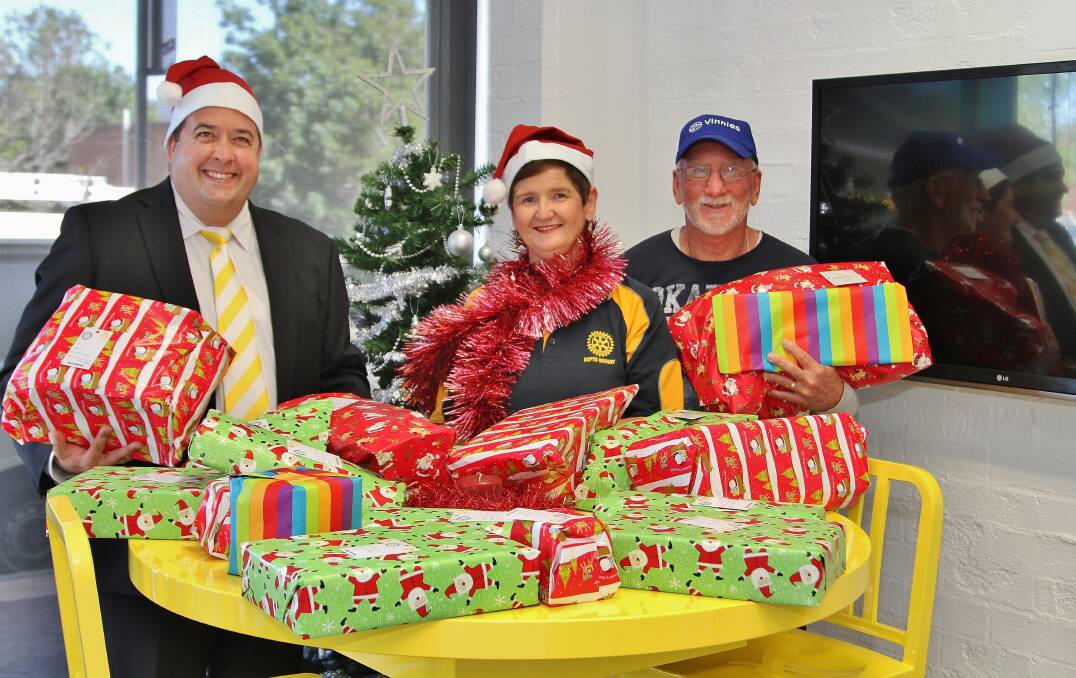 Daniel Norris, Anne McQueen and Brian Brennan at Dapto's Giving Tree. Picture by Greg Ellis.