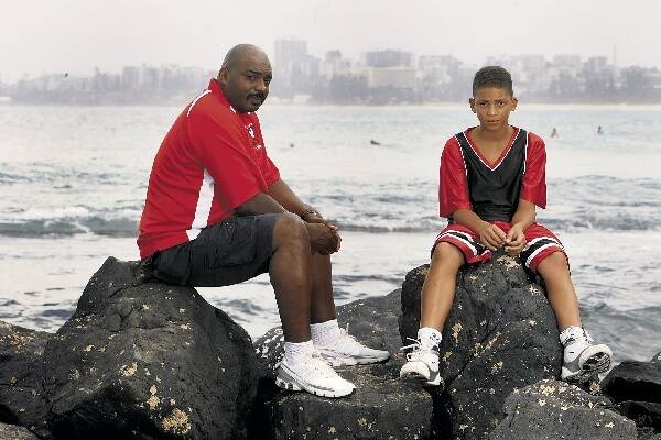 Hawks legend Norman Taylor, with his 14-year-old son, Adonis, a rising basketball star, believes the restructure of the game's national competition is a step backward for basketball in Australia. Picture: DAVE TEASE
